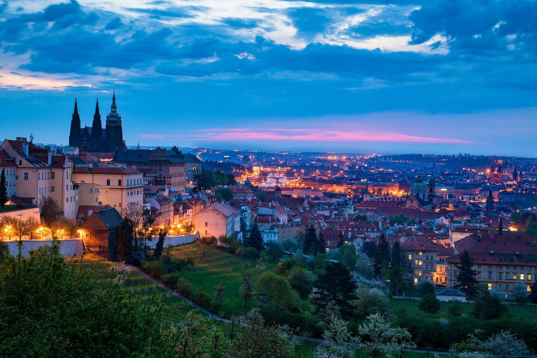 Prague Castle and St. Vitus Cathedral above the Vltava at dusk