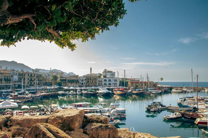 Harbour with fishing boats and mountains in Cyprus