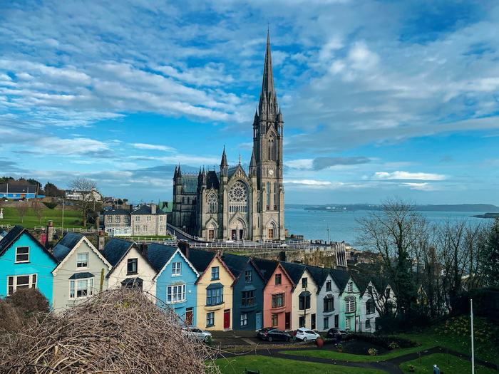 Colourful terraced houses below St Colman's Cathedral in Cobh, County Cork, overlooking Cork Harbour
